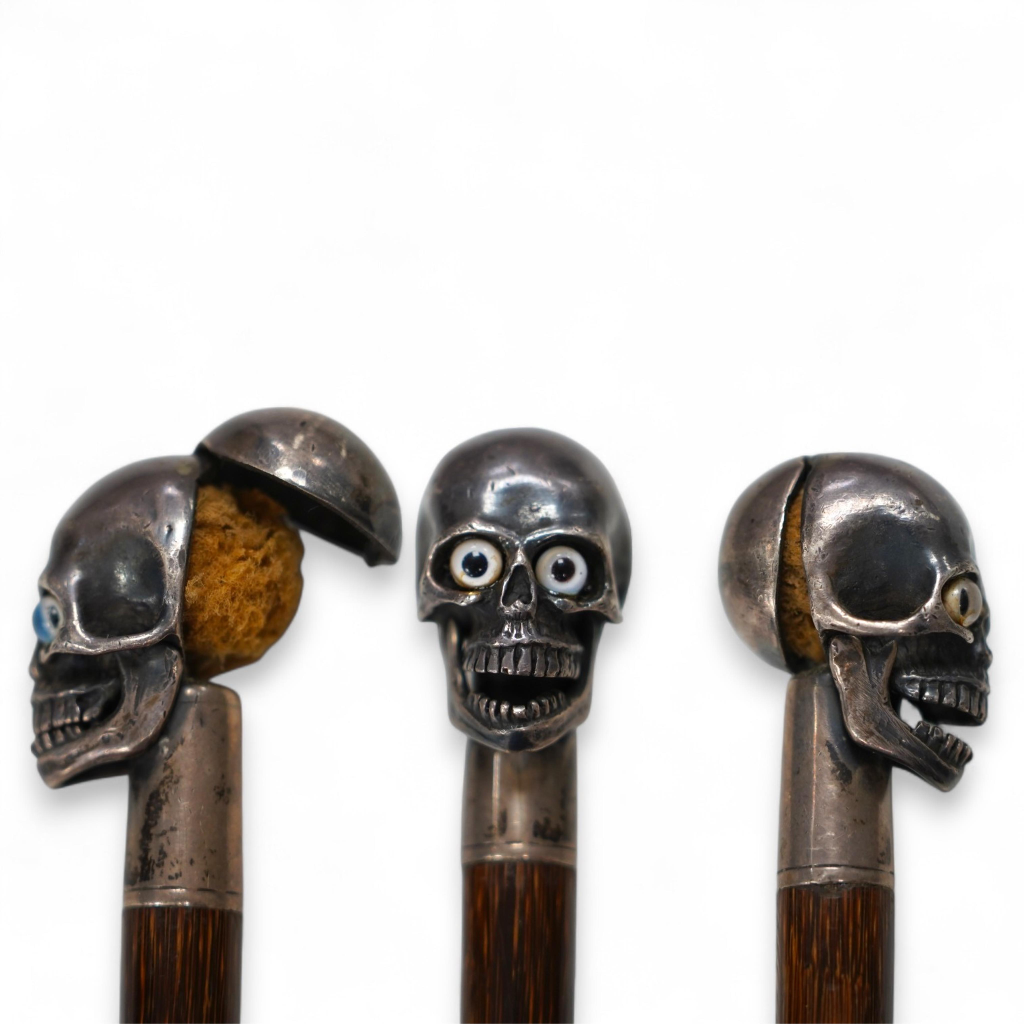 A 19th century bamboo walking stick with memento mori skull finial, the skull with articulated jaw, 84cm in length